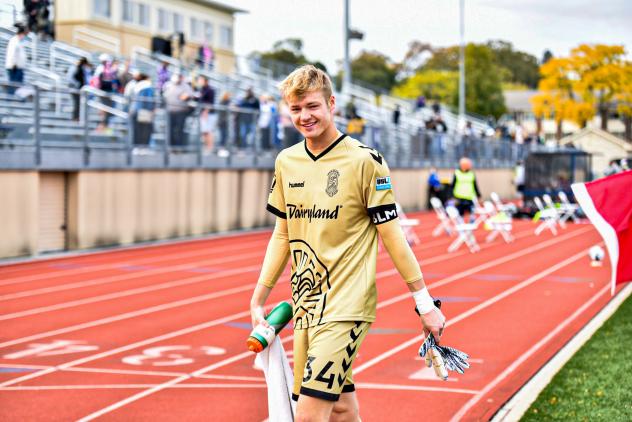 Forward Madison FC goalkeeper Chris Brady