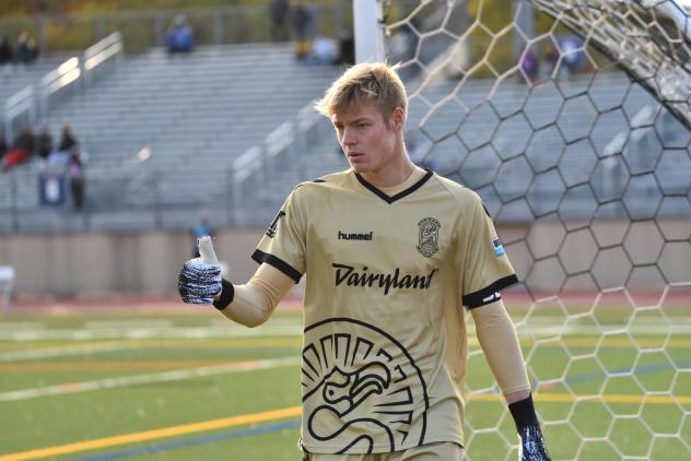 Forward Madison FC goalkeeper Chris Brady