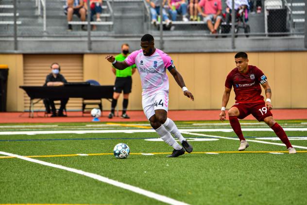 Forward Madison defender Josiah Trimmingham