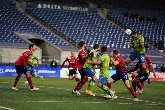 Seattle Sounders FC go high for a header against FC Dallas