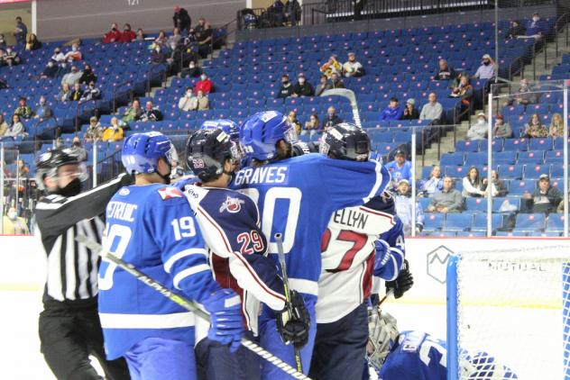 Wichita Thunder tussles with the Tulsa Oilers in their season opener