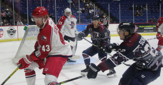 Allen Americans defenseman Matt Register (left) vs. the Tulsa Oilers