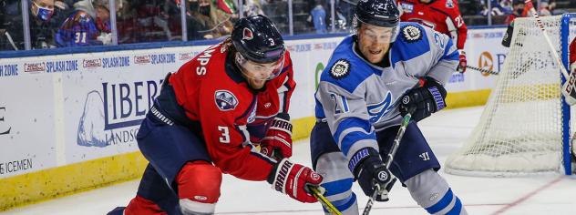 South Carolina Stingrays defenseman Macoy Erkamps (left) battles the Jacksonville Icemen