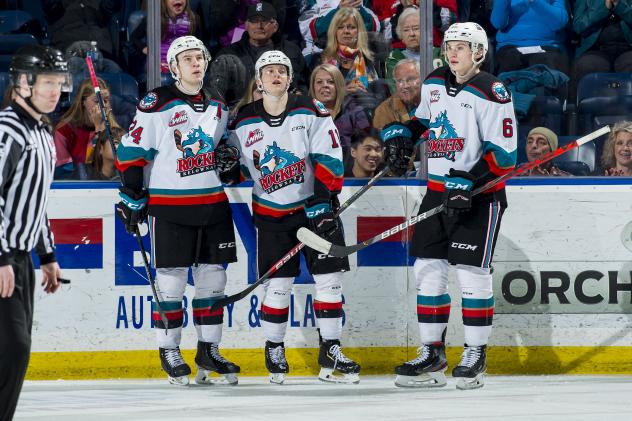 Kelowna Rockets forward Pavel Novak (centre) and defenceman Kaedan Korczak (right)
