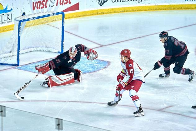 Corey Mackin of the Allen Americans (center) vs. the Rapid City Rush