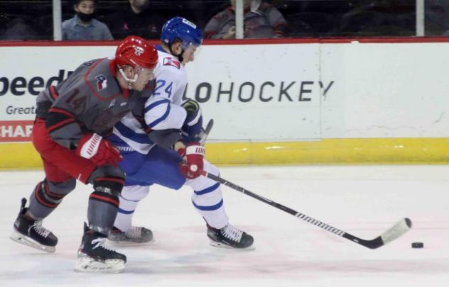 Wichita Thunder forward Bobby McMann (right) vs. the Allen Americans