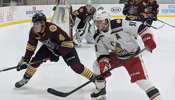 Grand Rapids Griffins center Kyle Criscuolo (right) vs. the Chicago Wolves