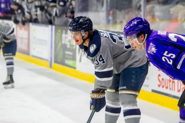 Sioux Falls Stampede forward Cole Sillinger (left) vs. the Tri-City Storm