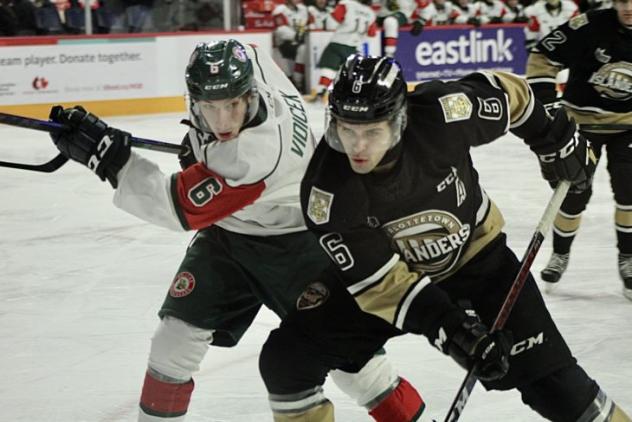 Charlottetown Islanders defenceman Noah Laaouan (right) vs. the Halifax Mooseheads