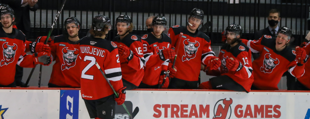 Michael Vukojevic and the Binghamton Devils bench