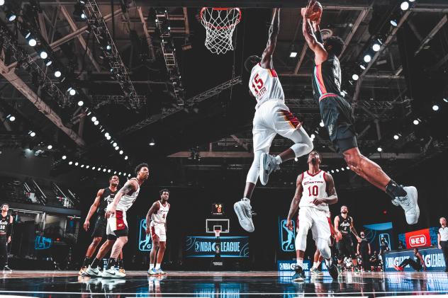 Canton Charge guard-forward Sir'Dominic Pointer flies at an Austin Spurs shooter