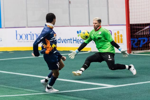 Florida Tropics goalkeeper Hugo Silva faces a shot from the Tacoma Stars' Jamael Cox