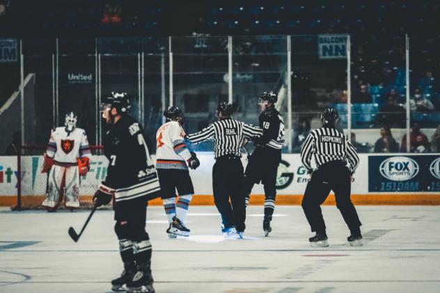 Officials separate the Odessa Jackalopes and Wichita Falls Warriors