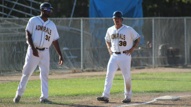 Vallejo Admirals Manager P.J. Phillips consulting with base runner Quintin Rohrbaugh