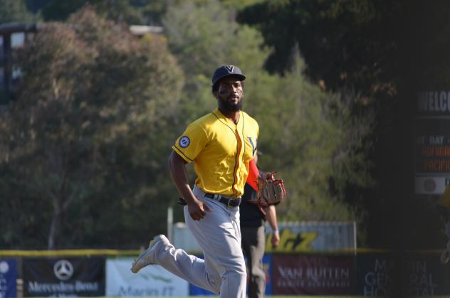 Nick Akins of the Vallejo Admirals takes a glance at the camera on his way back to the dugout