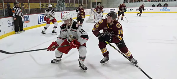 Grand Rapids Griffins right wing Jarid Lukosevicius (left) vs. the Chicago Wolves