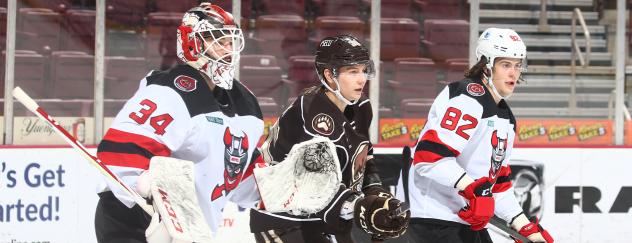 Binghamton Devils goaltender Evan Cormier and defender Nikita Okhotiuk vs. the Hershey Bears