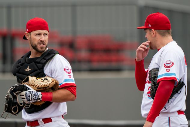 Catcher Logan Moore (left)
