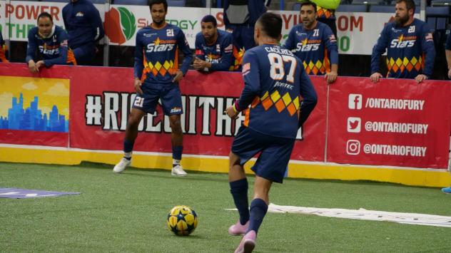 Alex Caceres (87) looks to pass to Willie Spurr (21) during the Tacoma Stars 7-5 loss to Florida Thursday