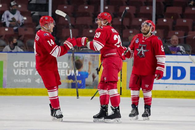Allen Americans exchange congratulations after a Jesse Mychan goal