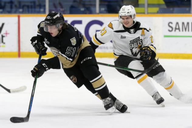 Charlottetown Islanders defenceman Lukas Cormier (left) vs. the Cape Breton Eagles