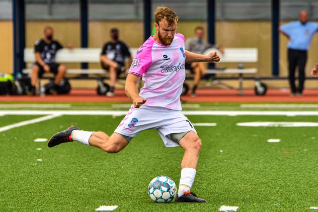 Forward Madison FC defender Connor Tobin