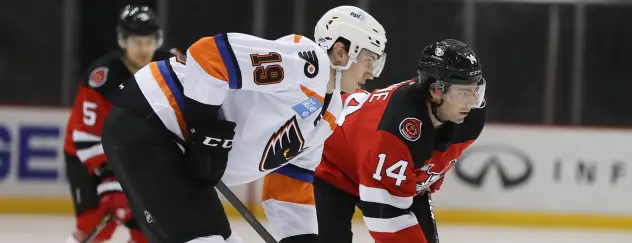 Binghamton Devils right wing Tyler Irvine (right) vs. the Lehigh Valley Phantoms