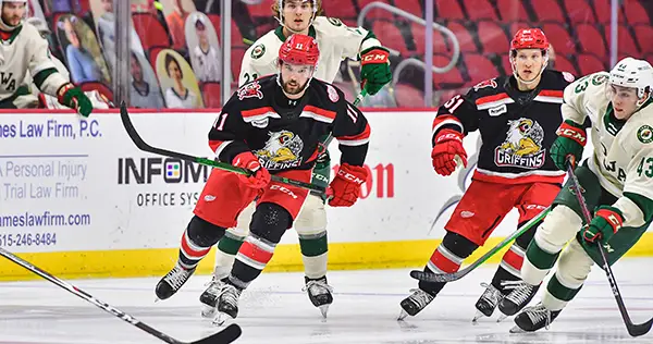 Grand Rapids Griffins right wing Riley Barber (left) and center Kyle Criscuolo vs. the Iowa Wild
