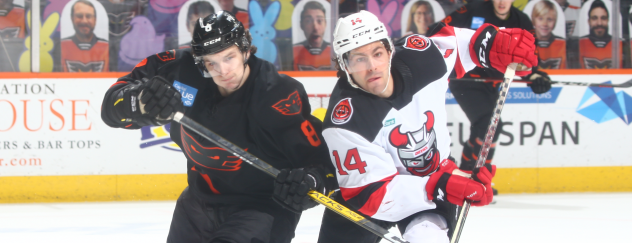 Binghamton Devils right wing Tyler Irvine (right) vs. the Lehigh Valley Phantoms