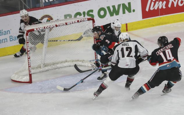 Adam Hall of the Vancouver Giants eyes a puck in front of the Kelowna Rockets goal