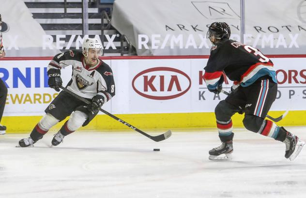 Vancouver Giants centre Tristen Nielsen (left) vs. the Kelowna Rockets