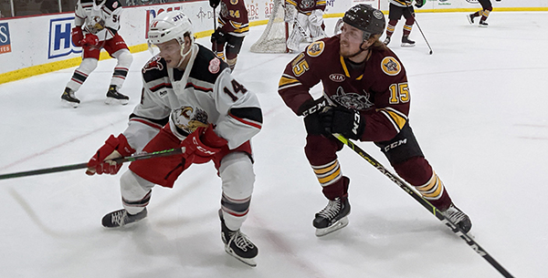 Grand Rapids Griffins right wing Jarid Lukosevicius (left) vs. the Chicago Wolves