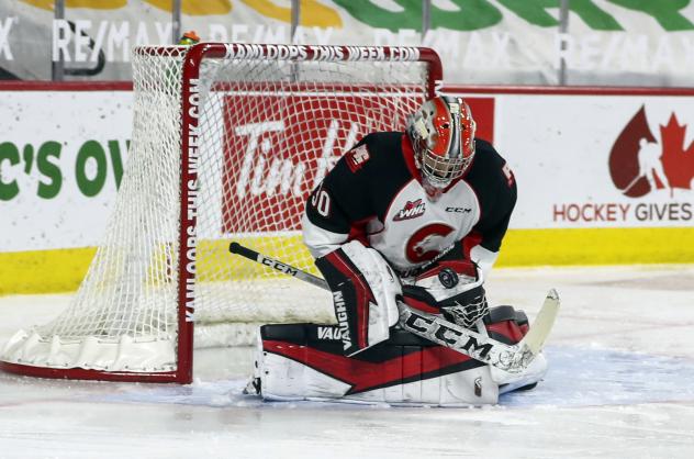 Prince George Cougars goaltender Tyler Brennan makes a stop against the Vancouver Giants