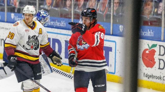 Rockford IceHogs forward Evan Barratt (right) vs. the Chicago Wolves