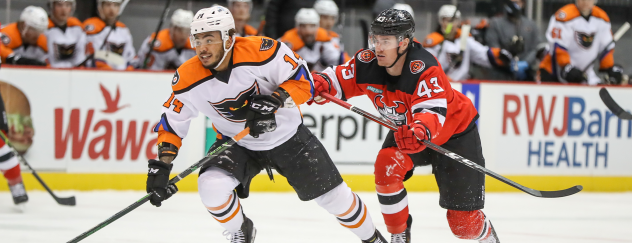 Binghamton Devils left wing Ben Thomson (right) vs. the Lehigh Valley Phantoms