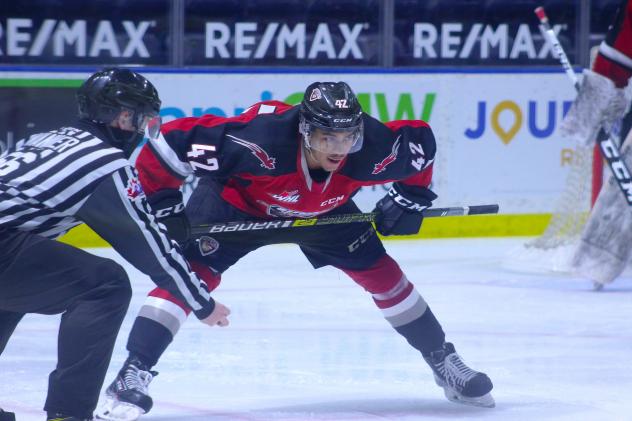 Vancouver Giants centre Justin Sourdif faces off with the Victoria Royals