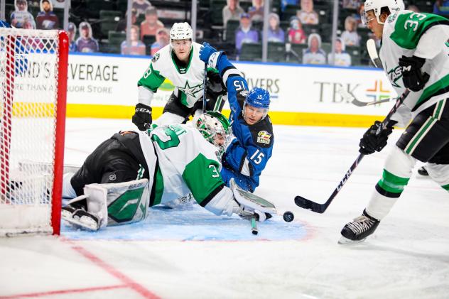Texas Stars goaltender Colton Point eyes a loose puck vs. the Colorado Eagles