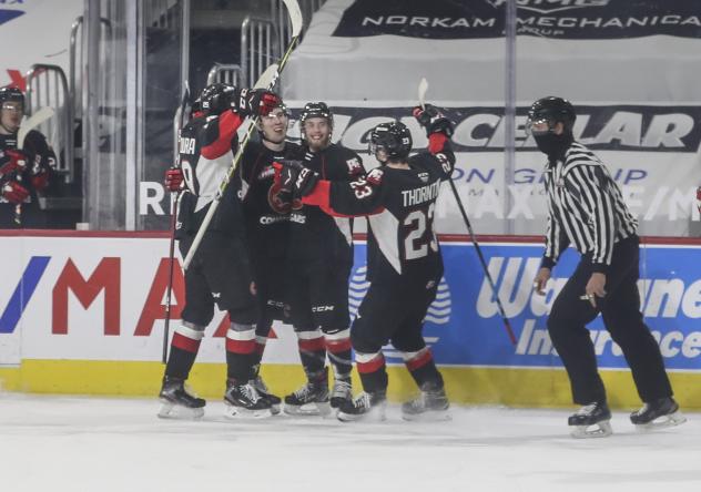 Prince George Cougars react after a goal vs. the Vancouver Giants