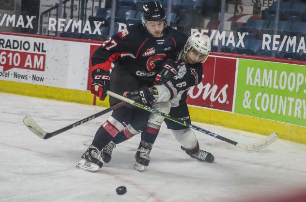 Riley Heidt of the Prince George Cougars delivers a blow vs. the Vancouver Giants