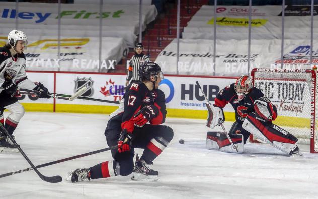 Prince George Cougars goaltender Tyler Brennan eyes a loose puck vs. the Vancouver Giants