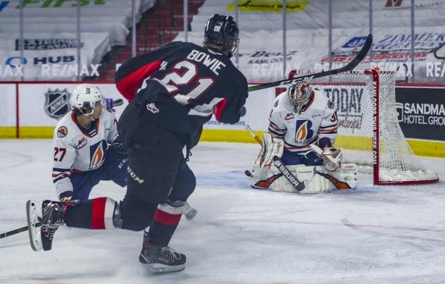 Connor Bowie of the Prince George Cougars takes a shot vs. the Kamloops Blazers