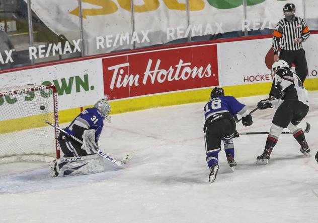 Vancouver Giants defenceman Alex Kannok Leipert (right) scores against the Victoria Royals