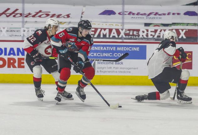 Kelowna Rockets centre Scott Cousins handles the puck against the Prince George Cougars