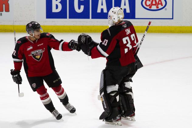 Vancouver Giants centre Justin Sourdif and goaltender Drew Sim