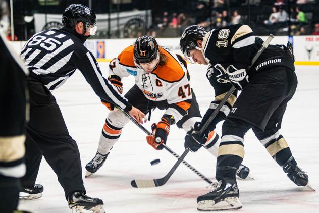 Wheeling Nailers forward Brady Tomlak (right) faces off with the Fort Wayne Komets