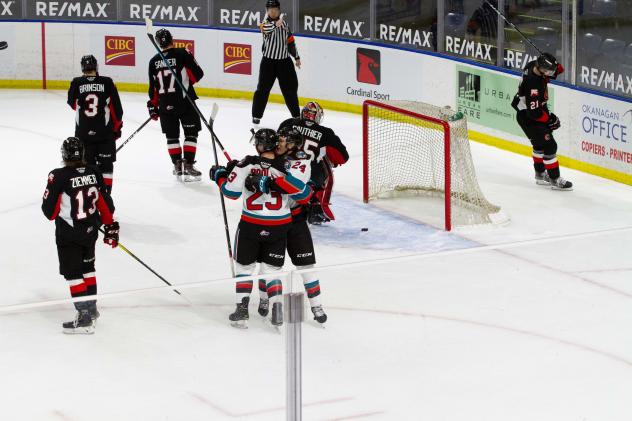 Jake Poole (23) and Dylan Wrightman of the Kelowna Rockets react after a goal against the Prince George Cougars