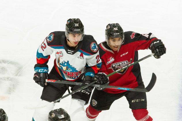 Vancouver Giants centre Justin Sourdif (right) vs. the Kelowna Rockets