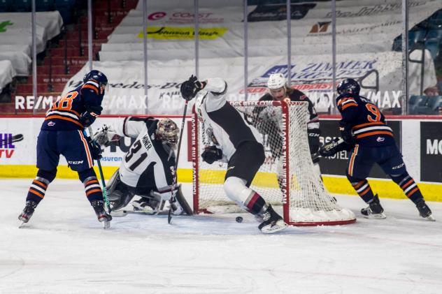 Vancouver Giants goaltender Trent Miner lunges for a loose puck vs. the Kamloops Blazers