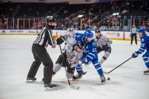 Wichita Thunder forward Spencer Dorowicz (51) tangles with the Kansas City Mavericks