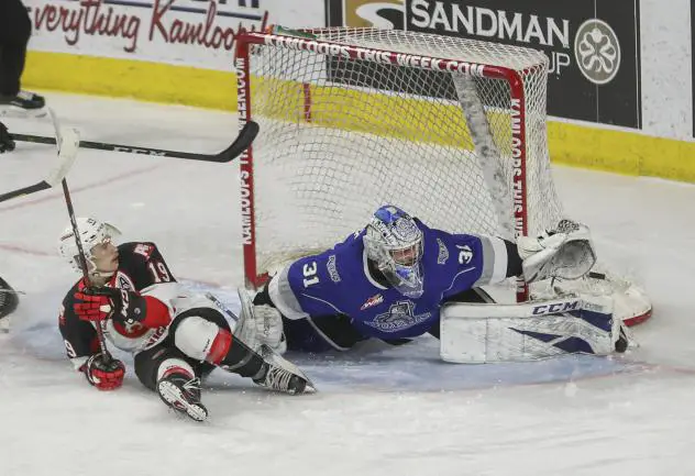 Prince George Cougars centre Ethan Browne meets the Victoria Royals goaltender